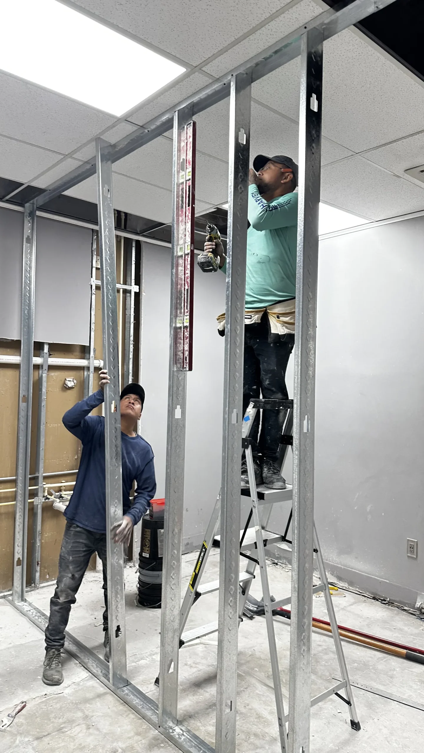 Harmony Med Spa reception wall installation process by Habitar 91